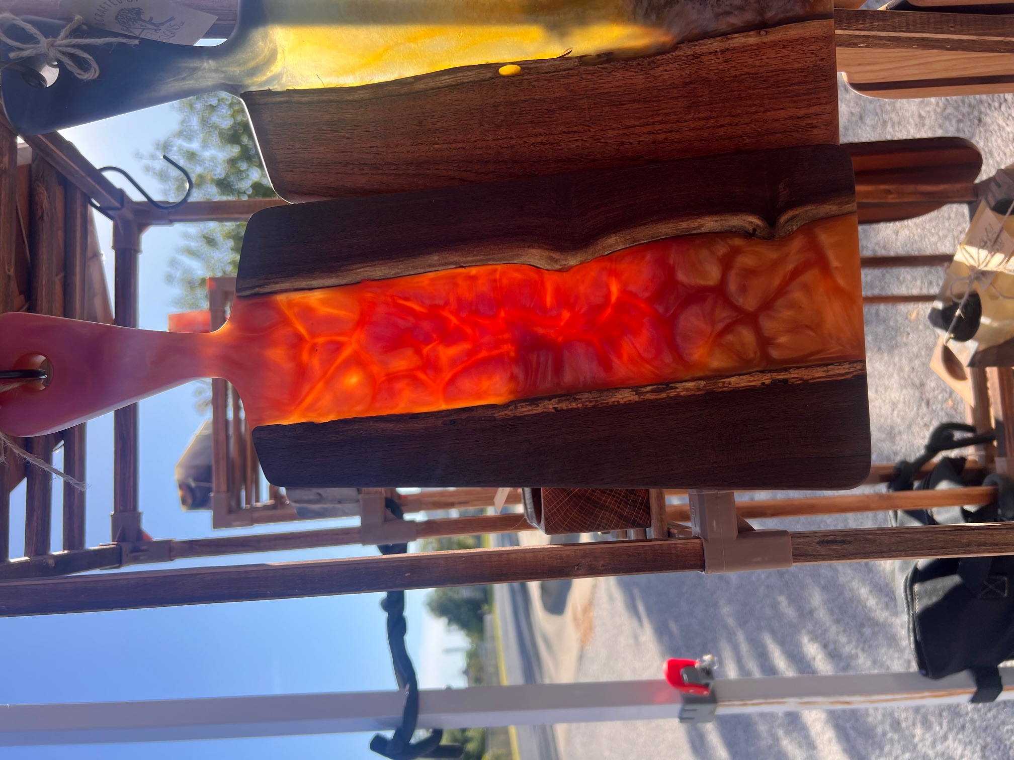 Handcrafted wood and glowing orange resin serving board by A&E Designs